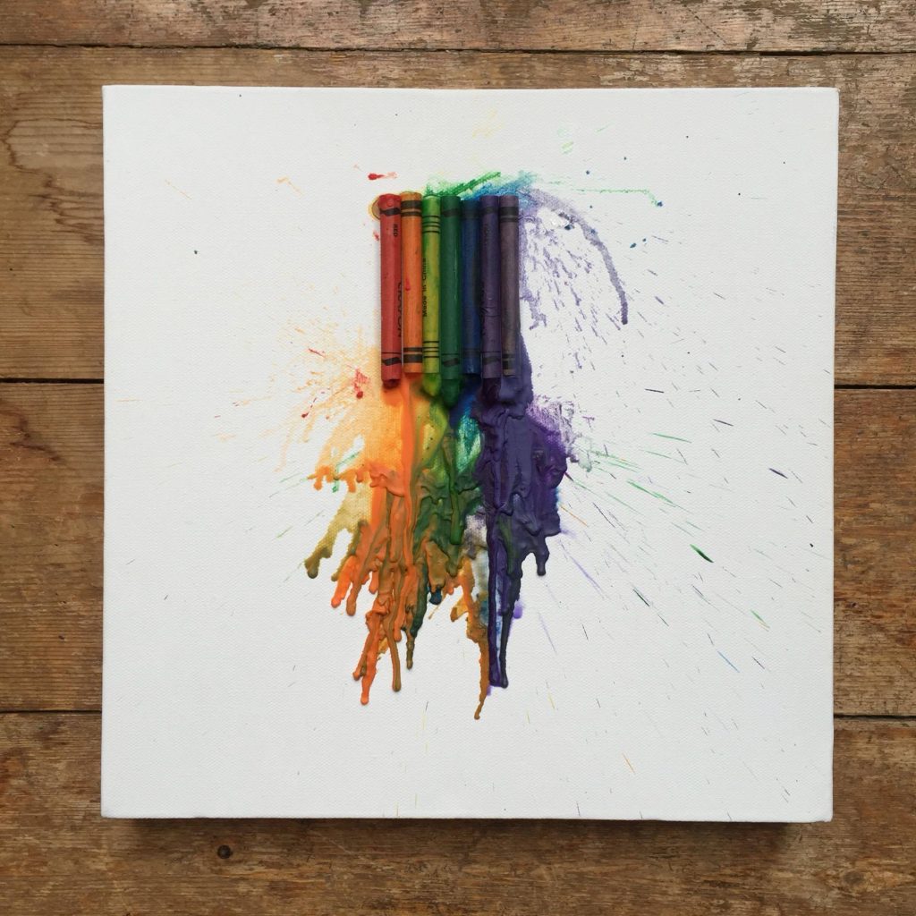 melted rainbow crayons on canvas